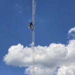 A crane crew from Hightower Communications Inc. mounts new antennas on The Filling Station’s tower in Pollocksville on Sept. 30.